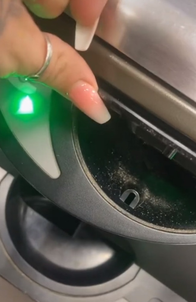 The video reveals flaps of coin slots can be lifted up to dump multiple coins at once, instead of one-by-one. Picture: TikTok