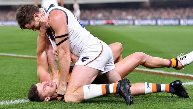 Heath Shaw wrestles with Dayne Zorko.