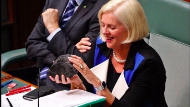 Andrews fondles a lump of coal in parliament.