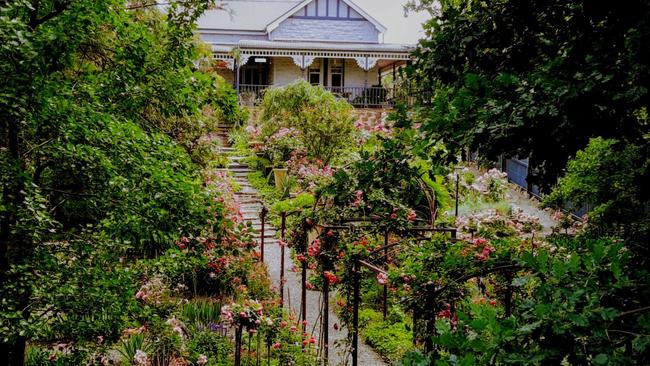 There are so many flowers you can barely see the house.