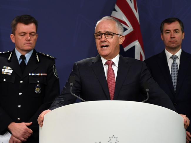 Australian Prime Minister Malcolm Turnbull outlined some of the new measure during a joint press conference this morning with AFP Commissioner Andrew Colvin (left) and Minister for Justice Michael Keenan (right). Picture: Sam Mooy/AAP
