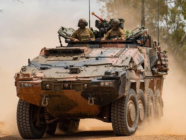 Soldiers from the 2nd/14th Light Horse Regiment (Queensland Mounted Infantry) in an Australian Army Boxer Combat Reconnaissance Vehicle conduct a battle run at Townsville Field Training Area, Queensland. *** Local Caption *** The 2nd/14th Light Horse Regiment (Queensland Mounted Infantry) conducted live fire training serials in the Townsville Field Training Area with the new Boxer Combat Reconnaissance Vehicles as they were introduced into service within the Australian Army. Soldiers conducting the training practiced firing smoke canisters from the platform’s Grenade Launching System to create obscuration, engaging targets with the MAG-58 Machine Gun, and honed their skills on the digitised 30mm Main Turret.