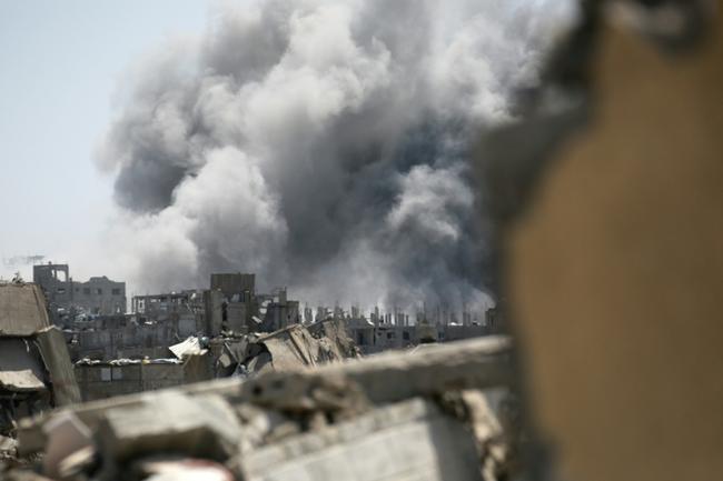 Smoke rises from the site of an Israeli strike in the northern Gaza Strip