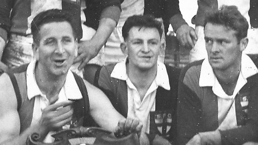 Bill Copping (centre) after winning with state Aussie rules title with Sorell.