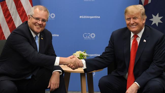 US President Donald Trump and Australia's Prime Minister Scott Morrison shake hands during a meeting in the sidelines of the G20 Leaders' Summit in Buenos Aires, on November 30, 2018. - Global leaders gather in the Argentine capital for a two-day G20 summit beginning on Friday likely to be dominated by simmering international tensions over trade. (Photo by SAUL LOEB / AFP)