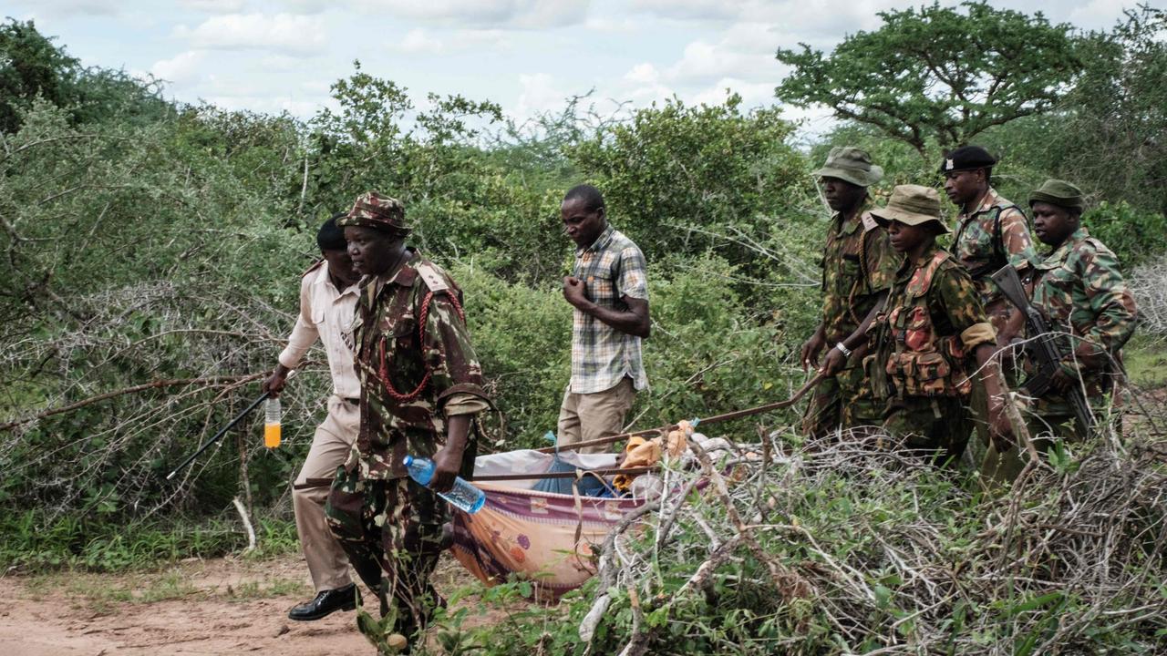 Security personnel carry a rescued young person from the forest in Shakahola in 2023. Picture: Yasuyoshi Chiba/AFP