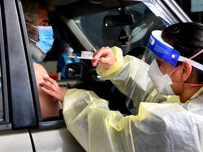 A person receives a dose of the Pfizer Covid-19 vaccine in Australia's first drive through vaccination centre in the outer Melbourne suburb of Melton earlier this month. Picture: AFP