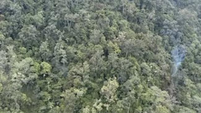 A rescue helicopter took this image of smoke rising from the crash site. Photo: CQ Rescue