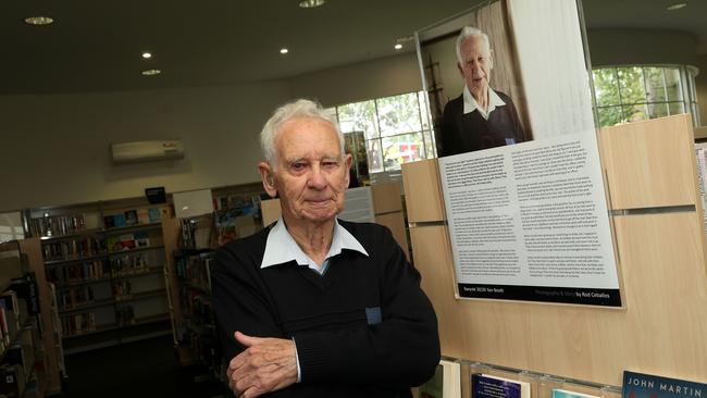 Ken Booth with his exhibition story in Watsonia. Picture: Hamish Blair