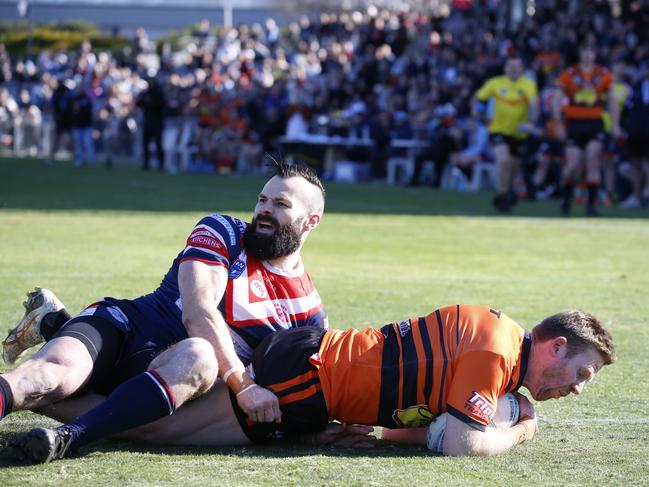 Ben Scambary dives over for the Tigers’ first try. Picture Warren Gannon Photography