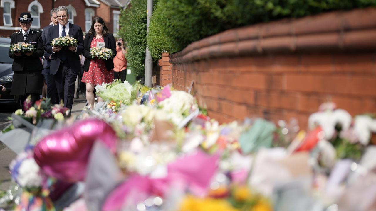 British Prime Minister Sir Keir Starmer arrives with a floral tribute to the child victims of a knife attack on July 30, 2024 in Southport, England. (Photo by Christopher Furlong/Getty Images)