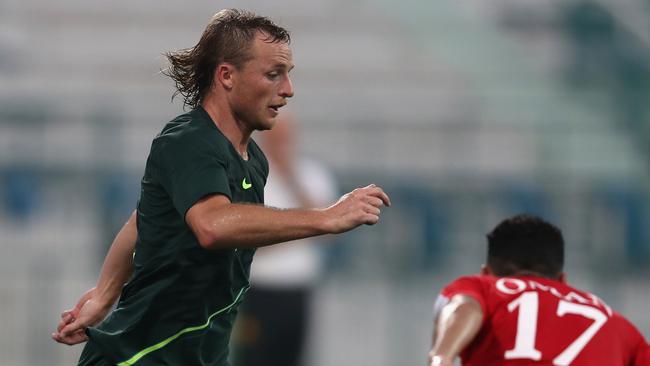 DUBAI, UNITED ARAB EMIRATES - DECEMBER 30:  Rhyan Grant of Australia competes for the ball with Ali Al Busaidi of Oman during the International Friendly match between Australia and Oman at Maktoum Bin Rashid Al Maktoum Stadium on December 30, 2018 in Dubai, United Arab Emirates.  (Photo by Francois Nel/Getty Images)