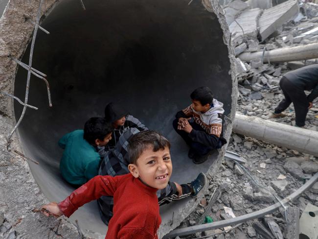 Children play in one of the fallen domes of the Al-Faruq mosque, levelled by Israeli bombardment in Rafah in the southern Gaza Strip. Picture: AFP