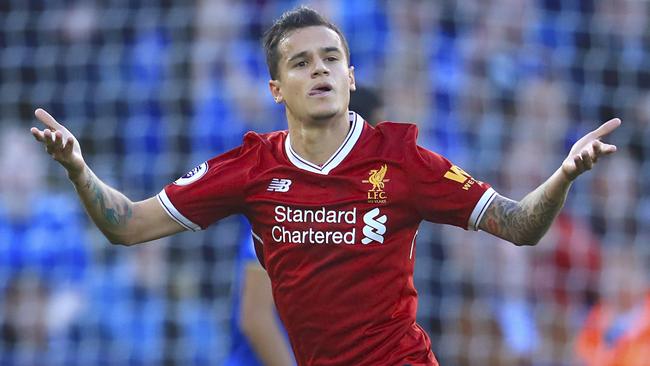 Liverpool's Philippe Coutinho, left, celebrates scoring his side's second goal of the game during the Premier League soccer match. Leicester City versus Liverpool at the King Power Stadium, Leicester, England,  Saturday Sept. 23, 2017. (Mike Egerton/PA via AP)