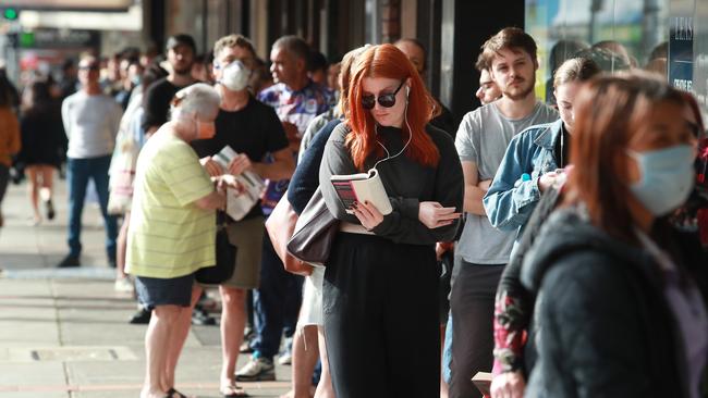 People queue at Centrelink in the Sydney suburb of Marrickville. Picture: John Feder.