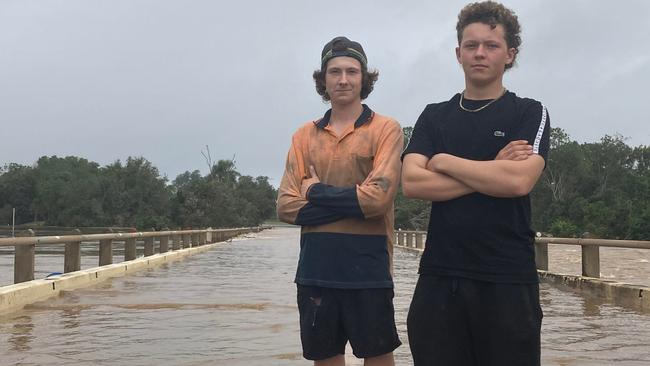 Brothers Kodie and Kai Crowther were among flood watchers at Gympie which is now isolated.