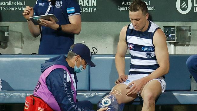 Mitch Duncan has ice strapped to his knee last Friday night. Picture: Michael Willson/AFL Photos via Getty Images