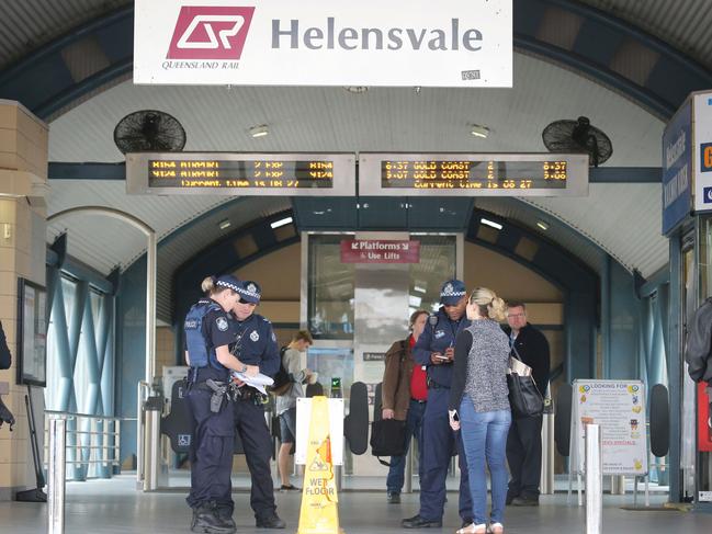 Police outside Helensvale Train Station. Picture: Glenn Hampson.