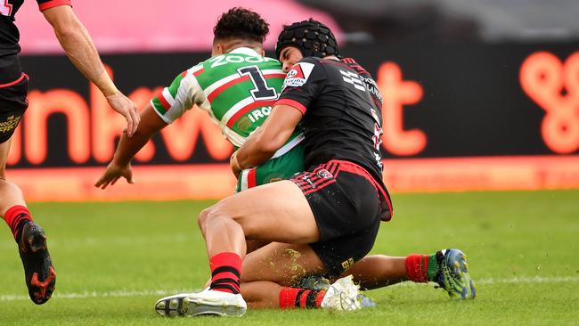 Joseph Suaalii brings down C.J Mundine in a routine tackle.