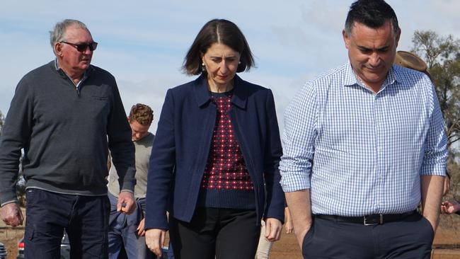 NSW Premier Gladys Berejiklian and Deputy Premier John Barilaro take a tour of Rosewood farm in Dubbo. Picture: AAP Image/Bradley Guest