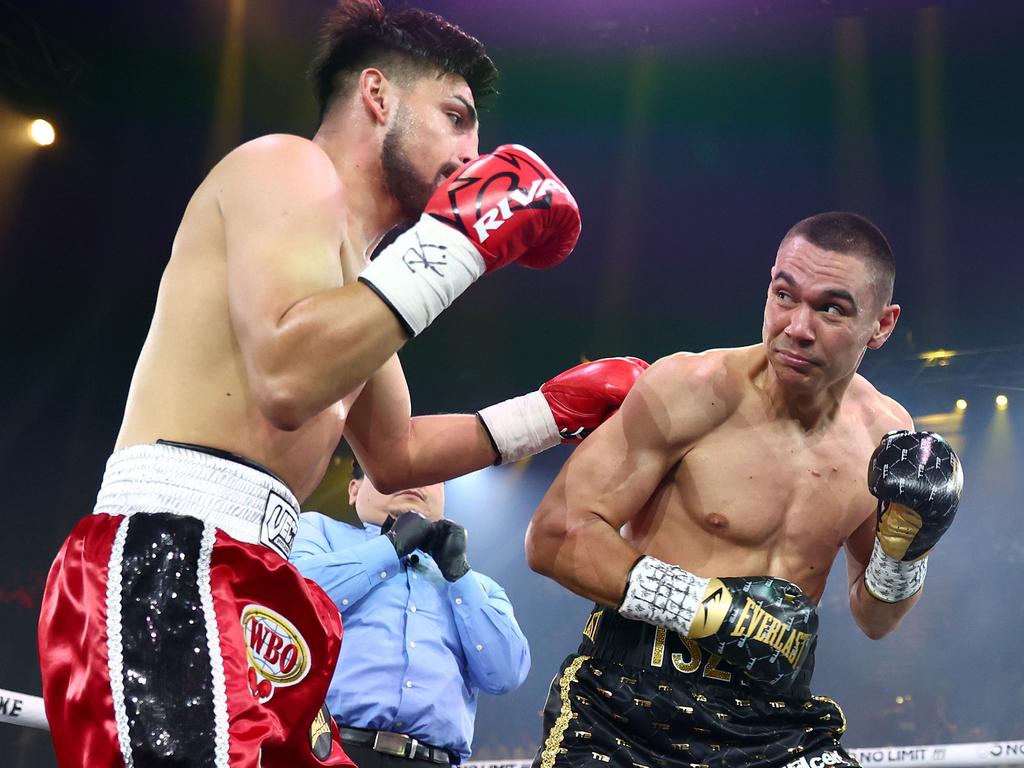 Tim Tszyu (right) punches Carlos Ocampo during the WBO Iterim Super-Welterwight title bout at Gold Coast Convention and Entertainment Centre. Picture: Chris Hyde/Getty Images.