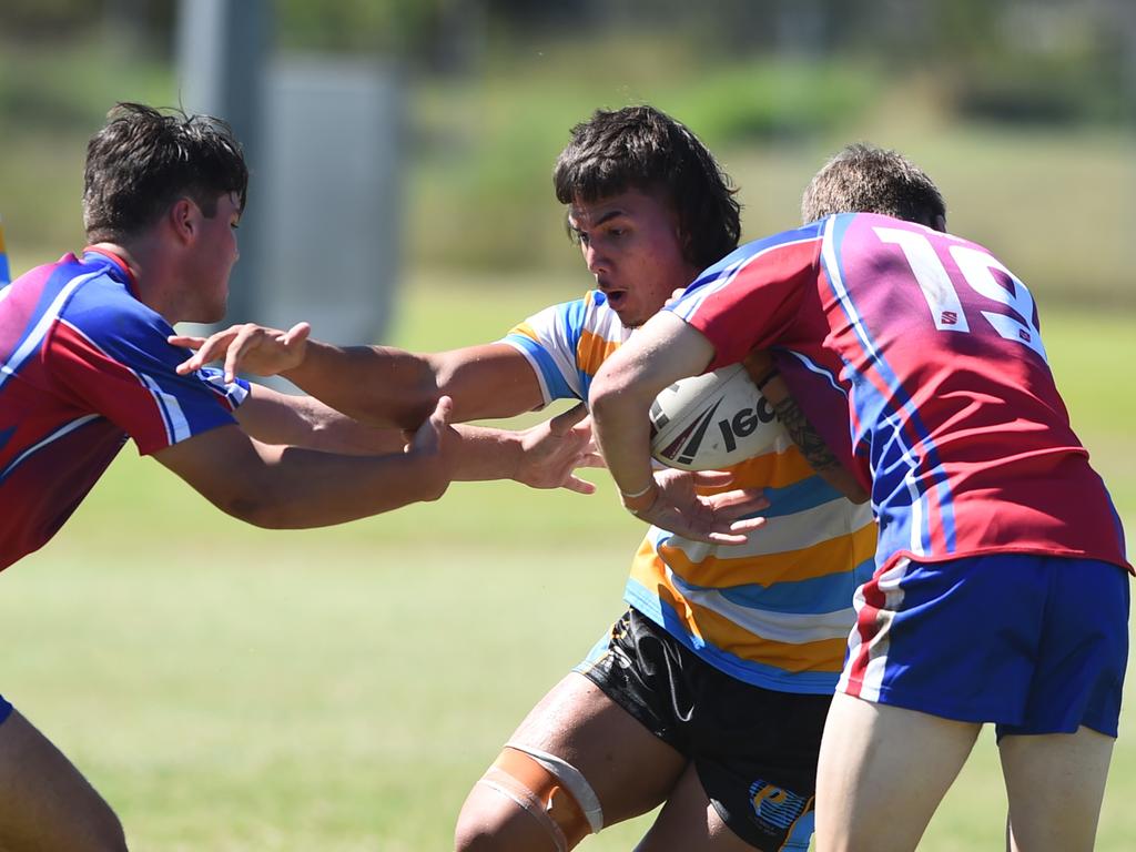 Boys Rugby League State Championship held at Northern Division, Brothers Leagues ground, Townsville. 16-18 years. Peninsula (stripe) v Darling Downs (blue/purple). Ben Nomani of Trinity Bay SHS.