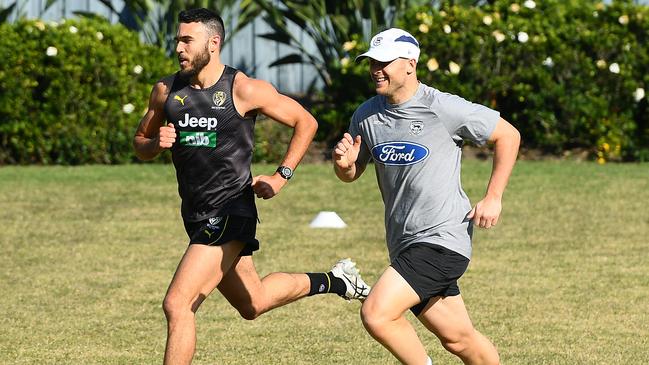 Shane Edwards and Gary Ablett train during quarantine in Queensland.