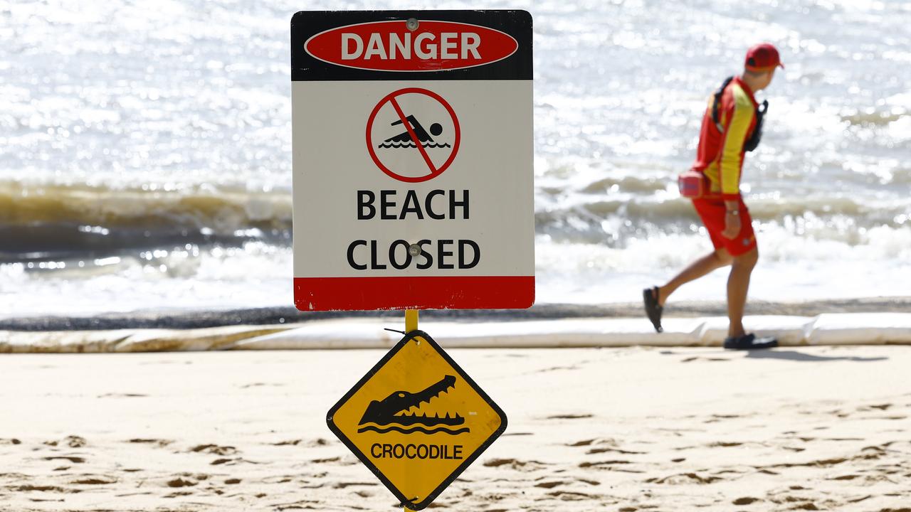 Danger - Beach Closed sign erected after a crocodile was spotted at Trinity Beach. Picture: Brendan Radke