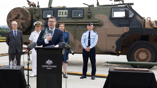 Defence Industry Minister Pat Conroy (centre) addresses the media during a press conference at the release of the Defence Industry Development Strategy at CEA Technologies in Canberra on February 29, 2024.