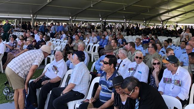 A large crowd gathers to show their respect at the 78th commemoration of the Bombing of Darwin on the Esplanade this morning