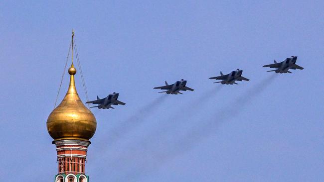 Russian MiG-31BM fighter jets fly over Red Square during the general rehearsal of the Victory Day military parade. Picture: AFP.