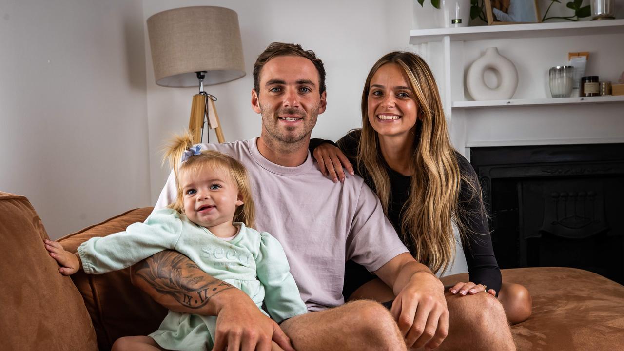 Port Adelaide star Jeremy Finlayson, Kellie Finlayson and their daughter Sophia. Picture: Tom Huntley