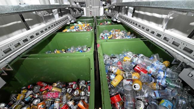 Deposited bottles are stacked into bins at the rear of the 'Return and Earn' recycling station. Picture: Tweed Daily News