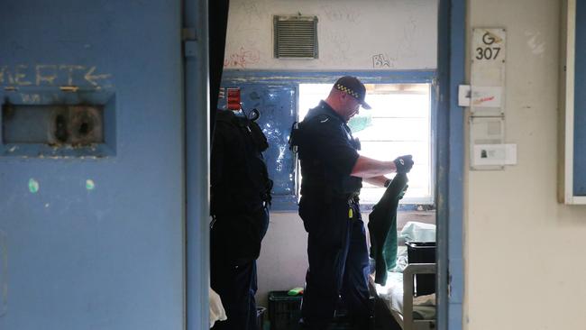 Corrective Services officers raid cells at Silverwater Jail looking for contraband. Picture: Richard Dobson