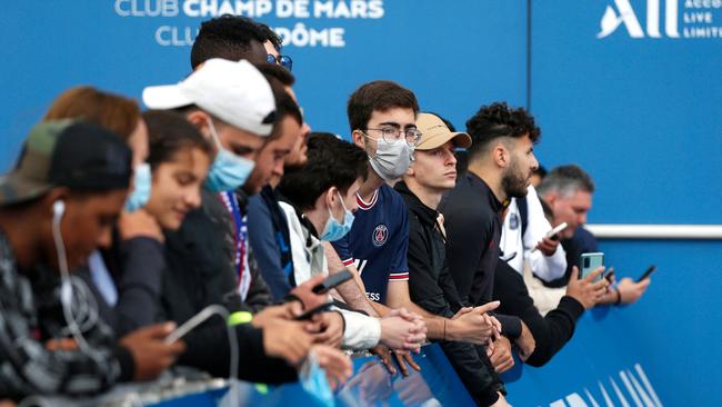Supporters stand at the entrance of the Parc des Princes stadium in Paris.