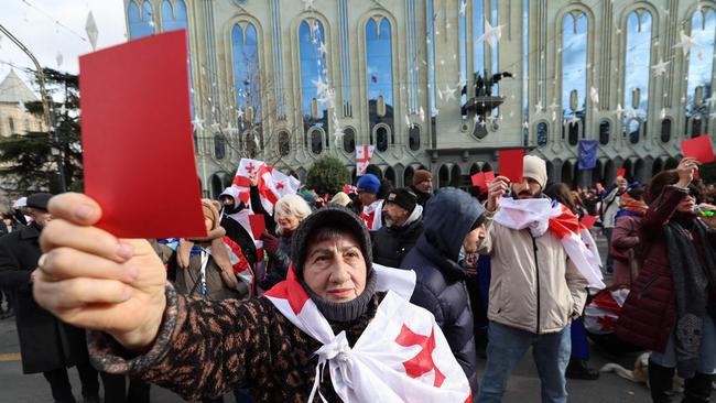 Protesters held up red cards as though calling out Kavelashvili for a foul on the political pitch, in Tbilisi on December, 29, 2024. Picture: AFP