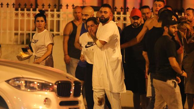 Mourners on the scene of the shooting murder of Nabil Maghnie. Picture: Wayne Taylor