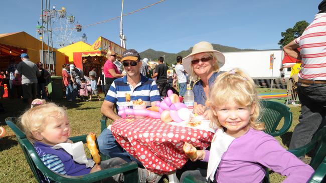 Jorja, Brian, Michelle and Hannah Hughes took a moment to indulge in a dagwood dog at the Pioneer Valley Show back in 2012. Picture: News Regional Media