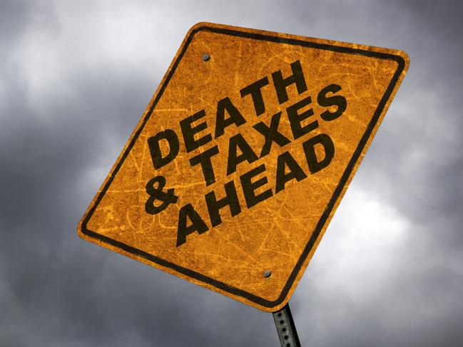 A road sign warning of the inevitability of death & taxes. inheritance tax generic