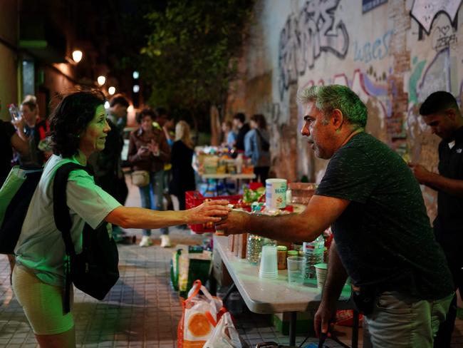 Volunteers organise distribution of food and drinks for the residents affected by deadly flash floods in Valencia, eastern Spain. Picture: AFP