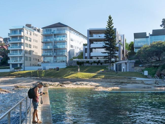 An artist's impression of the proposed apartment development at 5 Lauderdale Ave, Fairlight, (with the pine tree in front), with Fairlight Beach in the foreground. Picture: Platform Architects