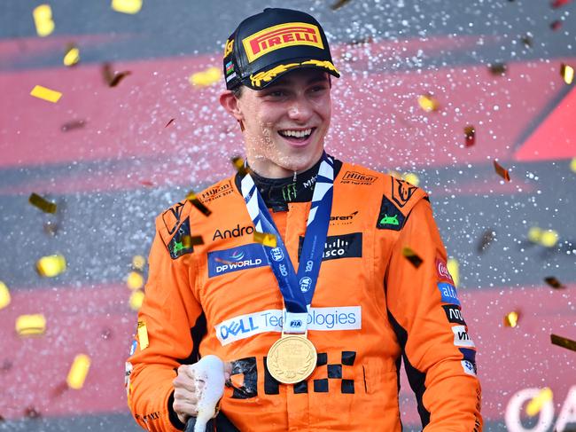 BAKU, AZERBAIJAN - SEPTEMBER 15: Race winner Oscar Piastri of Australia and McLaren celebrates on the podium during the F1 Grand Prix of Azerbaijan at Baku City Circuit on September 15, 2024 in Baku, Azerbaijan. (Photo by Dan Mullan/Getty Images)