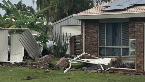 Fence obliterated as car crashes through front yard