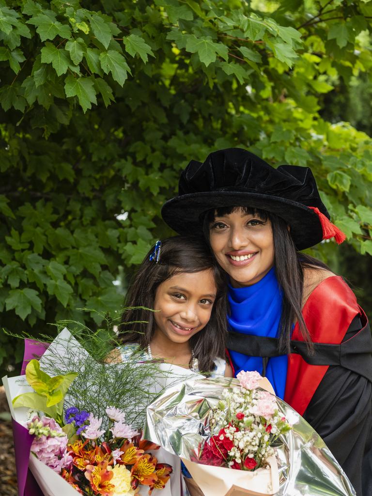 PhD graduate (chronic obstructive pulmonary disease) Hancy Issac with daughter Thea Arun at the UniSQ graduation ceremony at Empire Theatres, Tuesday, December 13, 2022.