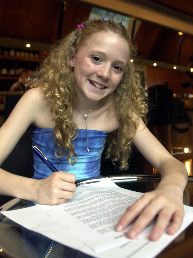 Nikki Webster signs her first record contract in November 2000. Pic Simon Cocksedge