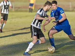 CLOSE BATTLE: Willowburn's Brayden Thrupp (left) competes with USQ's Alex Dyball. Willowburn plays Rockville tomorrow for a spot in the Toowoomba Football League premier men's grand final. Picture: Kevin Farmer