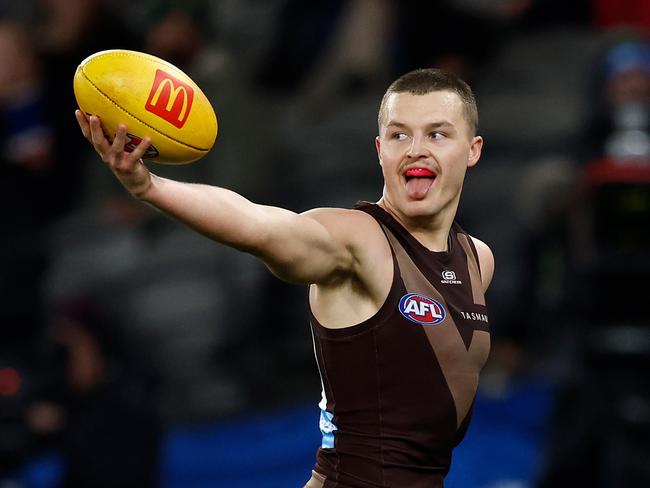 MELBOURNE, AUSTRALIA - JUNE 05: Jack Ginnivan of the Hawks shows the ball to Bulldogs players during the 2025 AFL Round 13 match between the Western Bulldogs and the Hawthorn Hawks at Marvel Stadium on June 5, 2025 in Melbourne, Australia. (Photo by Michael Willson/AFL Photos via Getty Images)