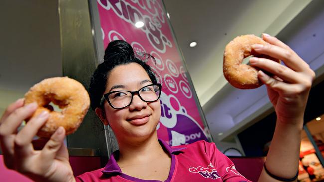 Fiona Sang prepares one of the last batches of cinnamon donuts as the store prepared to close its doors at Casuarina Square last year.