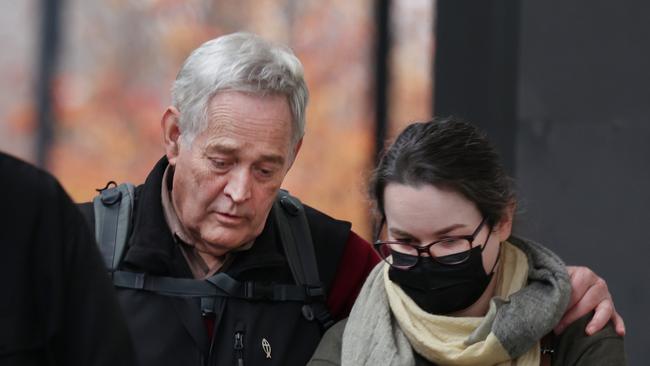 Mushroom meal survivor Ian Wilkinson leaves the court with one of his daughters on Friday. Picture: David Crosling/NewsWire