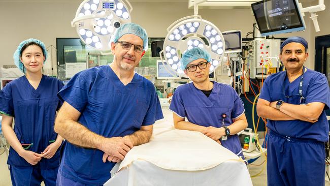 Surgeon Marcos Perini and the team Dr Sarah Qi, Dr. Dixon Woon and Dr. Jayapadman Bhaskar at The Austin Hospital. Picture: Jake Nowakowski